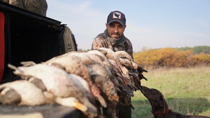 Naklejka premium hunting by the creek in the forest. And hunting birds. Hunter hunting at sunrise