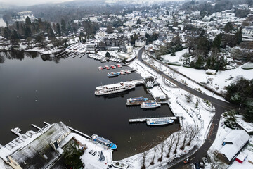 Lake Windermere,  Lake District in England in winter with snow on the ground. Aerial drone above view.