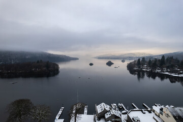 Lake Windermere,  Lake District in England in winter with snow on the ground. Aerial drone above view.