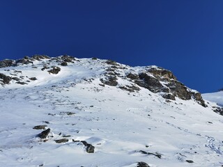 Fototapeta na wymiar winter walking in the alps, the hohe tauern national park in austria, at a cold and sunny day