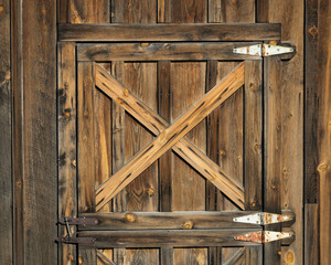 Wooden X pattern on weathered wooden door