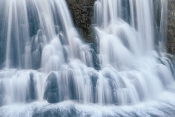 Naklejka na ściany i meble Big Sioux River waterfall at Falls Park in downtown Sioux Falls, South Dakota 