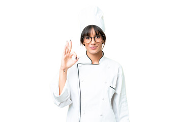 Young caucasian chef  woman over isolated chroma key background showing ok sign with fingers