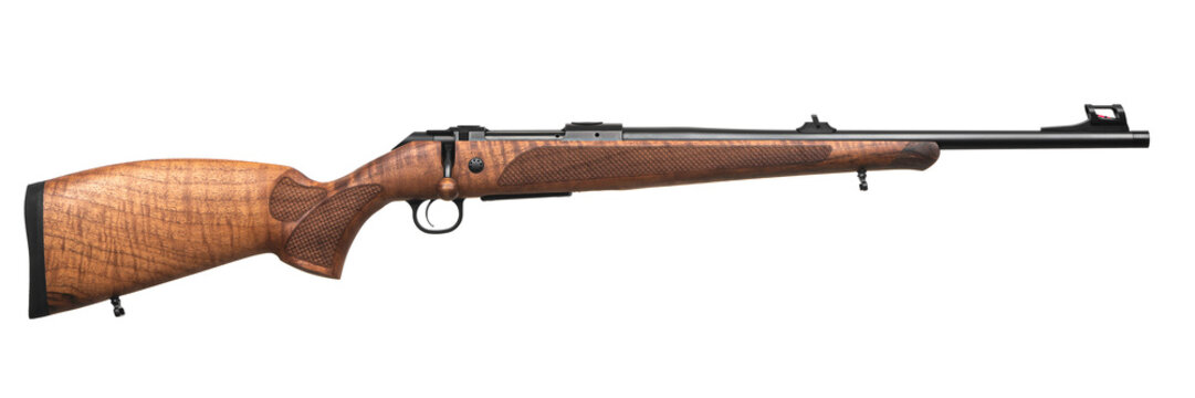 Modern bolt-action carbine with a wooden stock. Weapons for sports, hunting and self-defense. Isolate on a white back.