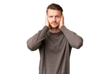 Young handsome caucasian man over isolated chroma key background frustrated and covering ears