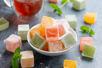 Sweets turkish delights with glass of tea