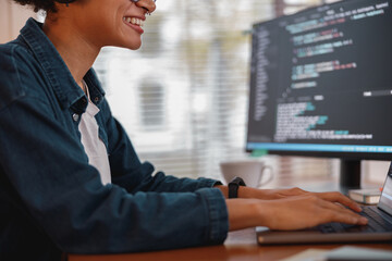 Female freelancer making new project as web designer and programmer on her computer at home office