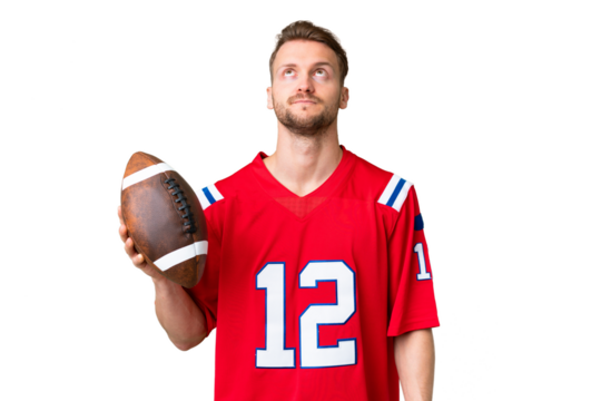 Young caucasian man playing rugby over isolated chroma key background and looking up - Powered by Adobe