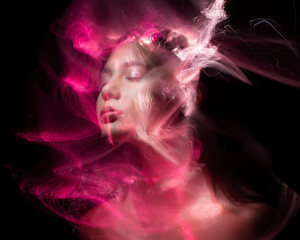 Abstract photography in the style of light painting. girl on a black background	