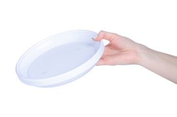 Disposable plastic dishes in hand on white background isolation