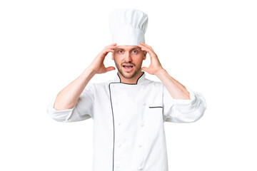 Young caucasian chef over isolated chroma key background with surprise expression