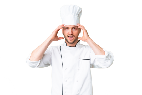 Young caucasian chef over isolated chroma key background with surprise expression