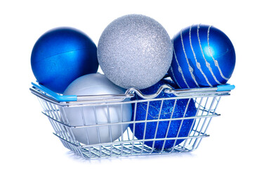 Silver and blue christmas tree balls in grocery basket on white background isolation