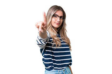 Young Uruguayan woman over isolated background showing and lifting a finger