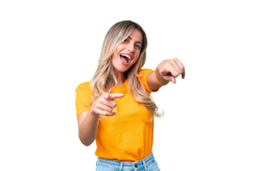 Young Uruguayan woman over isolated background pointing to the front and smiling