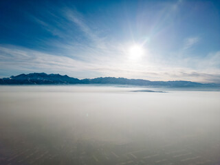 Aerial view of polluted city covered with smog