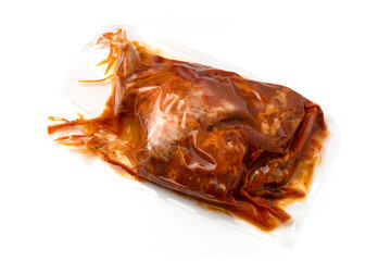 Beaf steak vacuum sealed ready for sous vide cooking isolated on white background