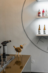 Funny figure made of potatoes and wooden sticks in a cafe.