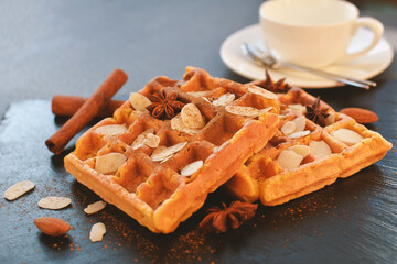 Warm  Belgian waffles with almonds, decorated almond chips , anise stars and cinnamon sticks.