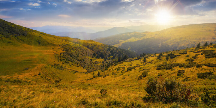 picturesque view of carpathian mountains at sunset. green landscape with hills rolling in to the distant ridge. alpine meadows beneath a sky with clouds in evening light