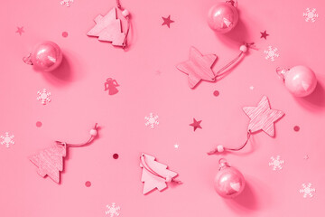 Christmas composition. Present decorations with ball sail Champagne on pink background. Flat top view. Trendy color of year 2023 - Viva Magenta.
