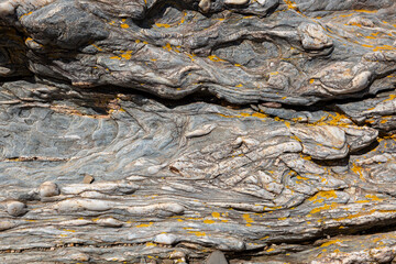background of a dark shale stone with inlaid quartzites