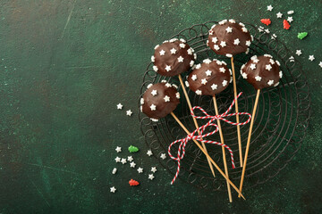 Marry Christmas sweet cake pops. Christmas dessert round brownie cake pops with stars topping on...