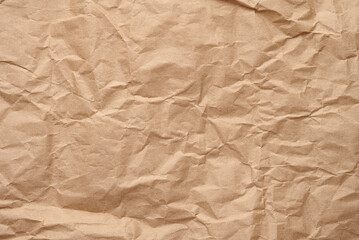 Fototapeta premium Texture of brown crumpled craft paper, full frame