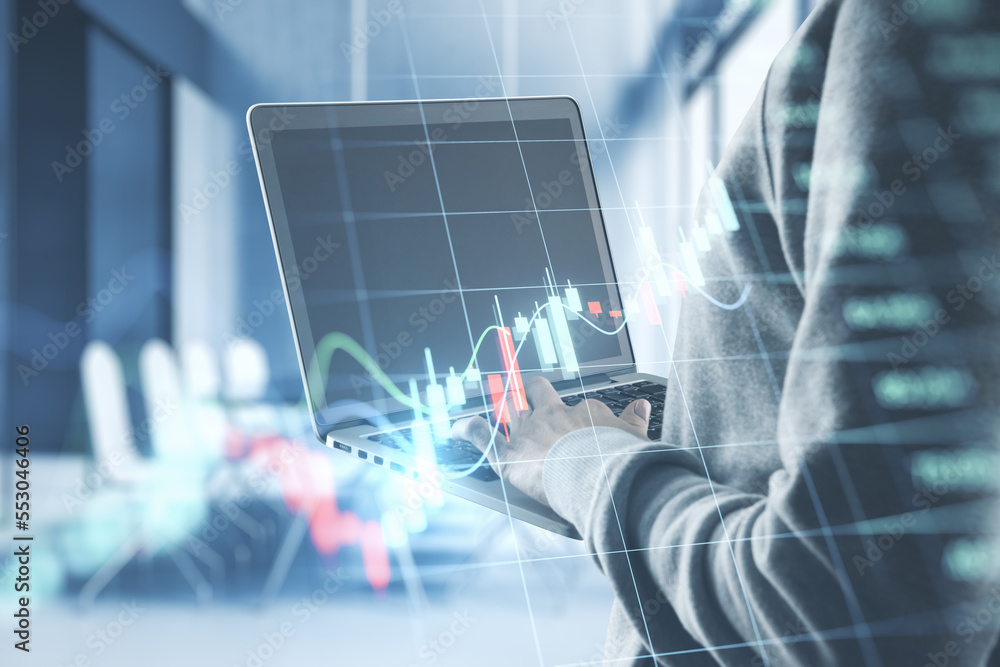 Poster close up of hands using laptop with glowing business forex chart hologram and grid on blurry office 