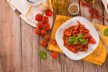 Lentil pasta with cherry tomatoes and basil.