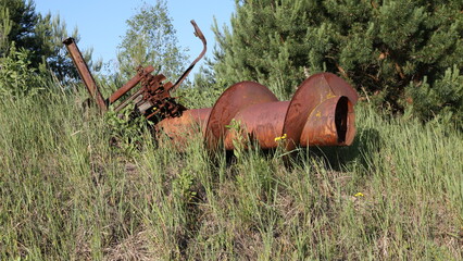 Dump of radioactive equipment. Burial of agricultural machinery in Chernobyl. Chernobyl exclusion zone