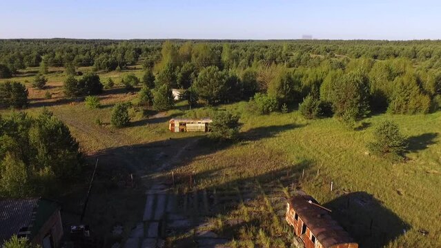 Aerial view. The burial ground of radioactive agricultural machinery in the Chernobyl zone. Abandoned farm in Chernobyl. Chernobyl Exclusion Zone. Ukraine.