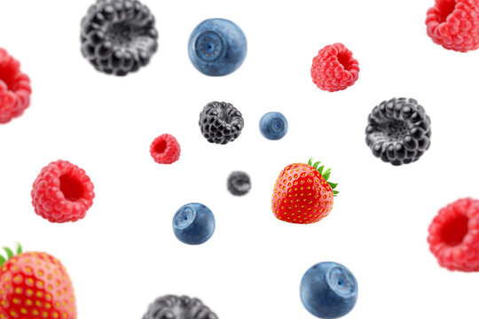 Falling wild berries mix, strawberry, raspberry, blueberry, blackberry, isolated on white background, clipping path, full depth of field