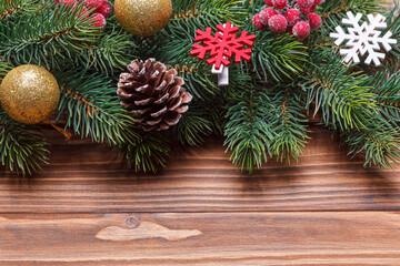beautiful branches of the Christmas tree with cones and toys