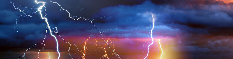 Fototapeta na wymiar Fork lightning striking down during summer storm 