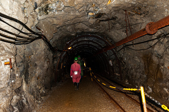 Chesky Krumlov, Czech Republic - May 7, 2018: Woman Walking Through The Underground Graphite Mine That Shows Mining History Of South Bohemia