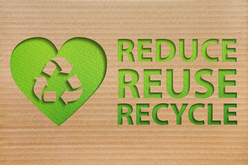Refuse reuse recycle symbol with cardboard background