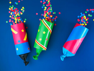 creative background with homemade poppers for Juneteenth or Kwanzaa, DIY paper cracker
