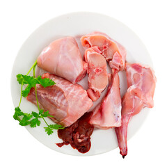 Raw rabbit meat with natural ingredients before cooking, nobody. Isolated over white background