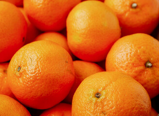 Close up of pile of juicy fresh mandarins or tangerine.