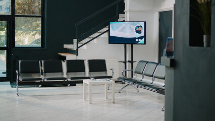 Health center waiting room lobby for patients to sit before checkup visit with physician, empty...