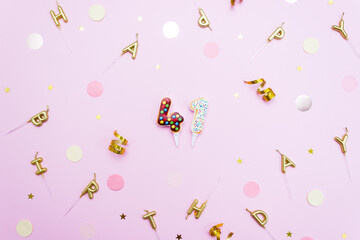 Numeral 41 in the form of donuts surrounded by decorative elements for party. Anniversary or birthday concept at the age of 41. Selective focus