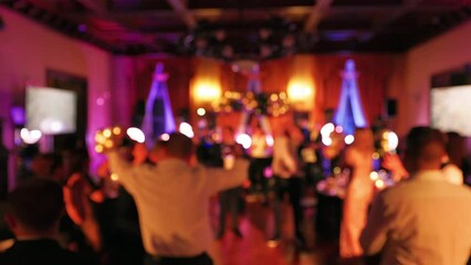 Blurry: People are dancing and partying at a New Year Eve's event