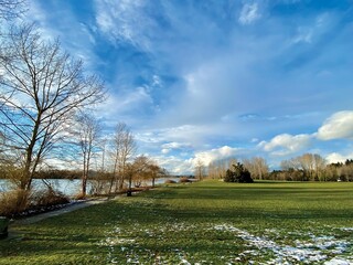 Fraser River Park in Vancouver, British Columbia, Canada. Some area of the field was still covered by snow in the sunny afternoon.