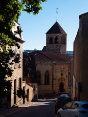 Exterior view of Eglise Notre-Dame under clear blue sky. Church in French city from outdoors.