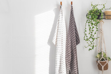 Family towels hanging sunny light white bathroom wall spa shower hygiene fabric textile
