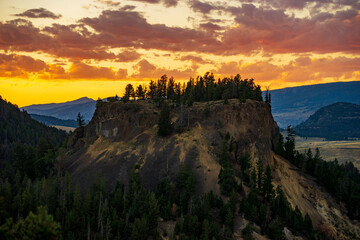 Sunset behind a hill from Calcite Springs viewpoint in Yellowstone National Park