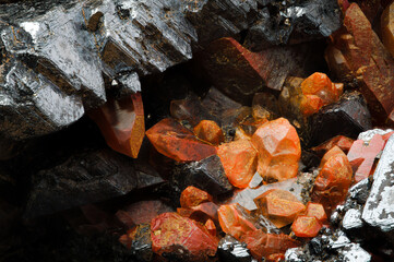 hematoid quartz on magnetite macro detail texture background. close-up raw rough unpolished...