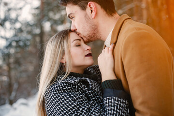 happy couple walking through the park