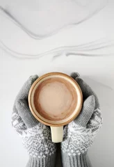Abwaschbare Fototapete Gloves holding mug of hot chocolate © fotogal